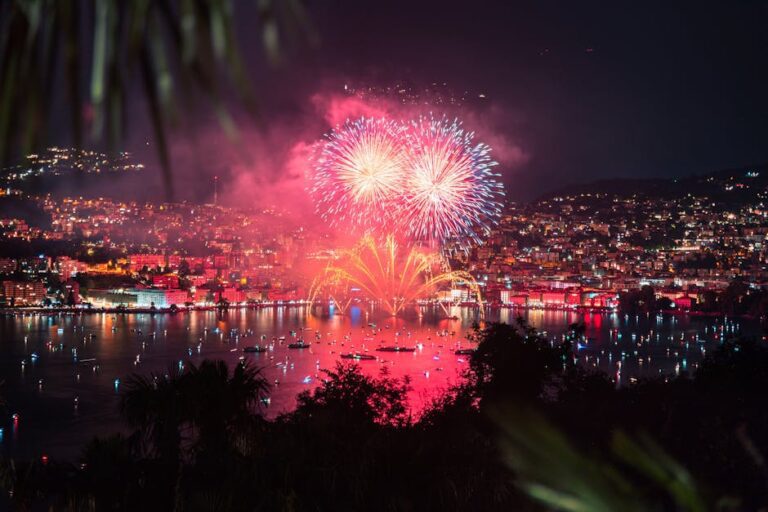 Stunning fireworks light up the night sky over Lake Lugano, Switzerland. A celebration of color and light.